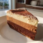 Decadent Triple Chocolate Mousse Cake with Cocoa Dusted Topping