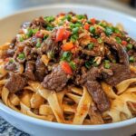 Korean Bulgogi Beef Alfredo with Chili Crunch & Pickled Radish Garnish