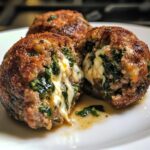 Spinach and garlic meatballs stuffed with mozzarella
