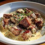 Tender steak cubes in tempting parmesan cream sauce